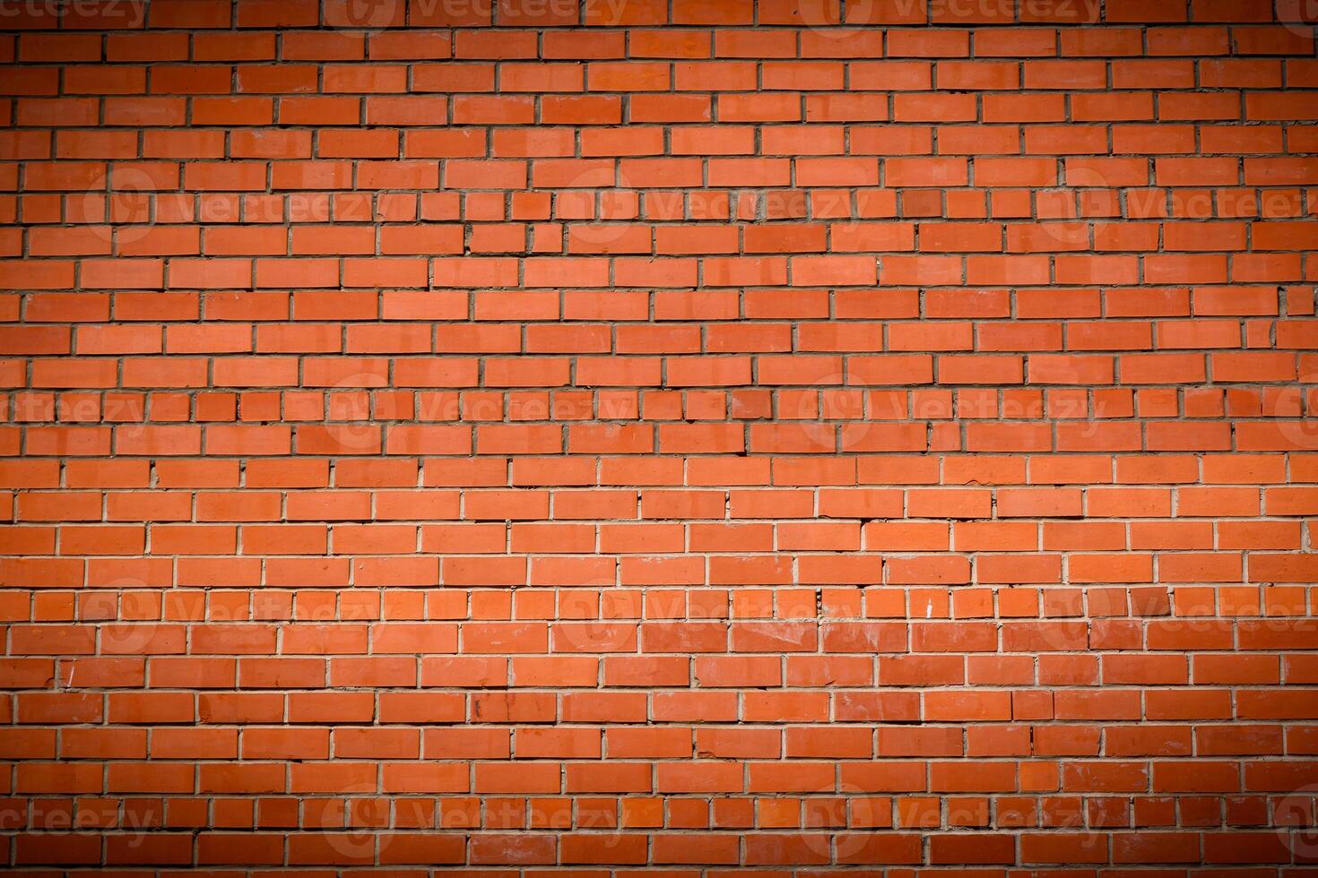 Red brick wall with vignette texture background photo