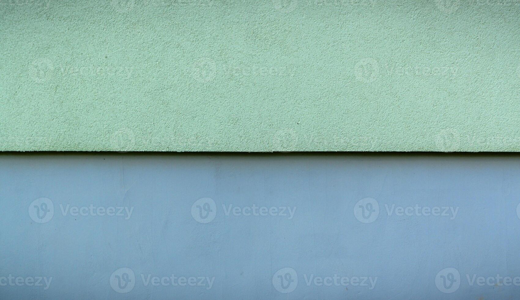 The walls are made of cement, painted in two colors top green, bottom blue. photo