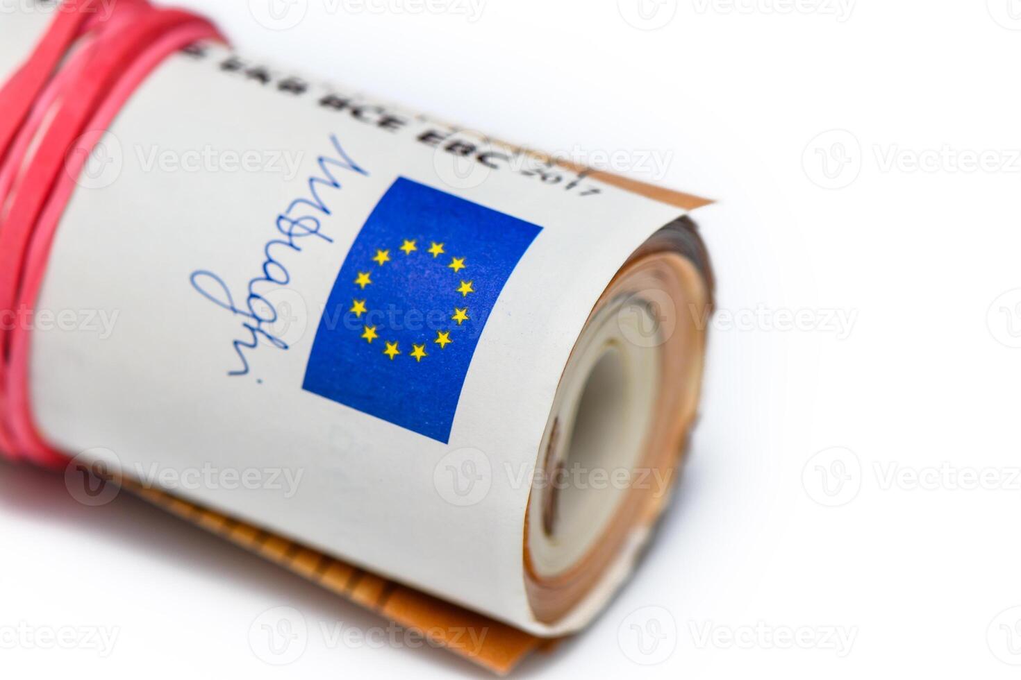 Concept of many euros a pile of rolled 50-euro bills lying on a white background photo