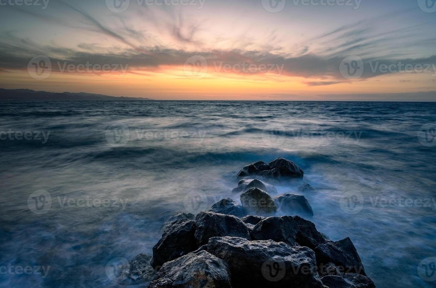 the blue hour over the sunset in the meditereanen sea photo