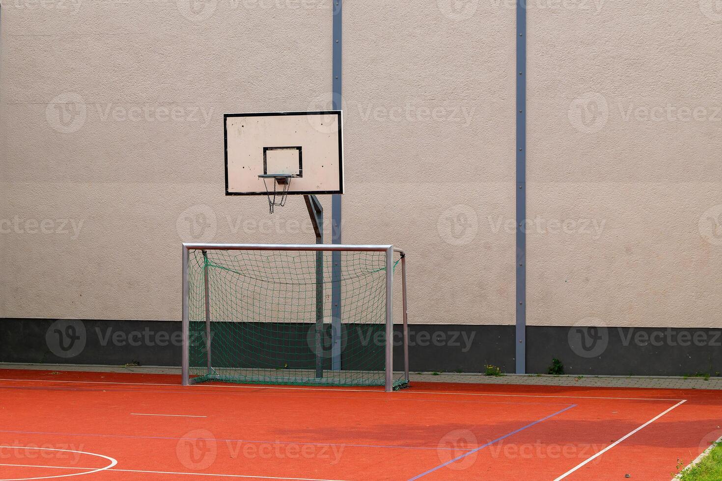 basketball hoop is standing in front of a wall photo
