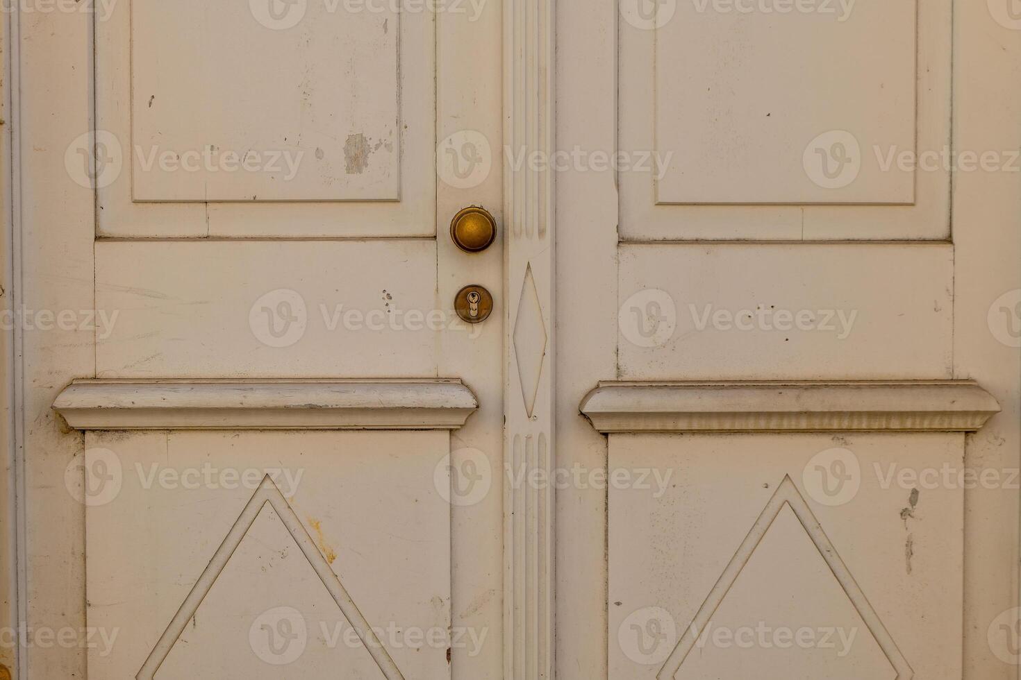 door is old and has a gold knob photo