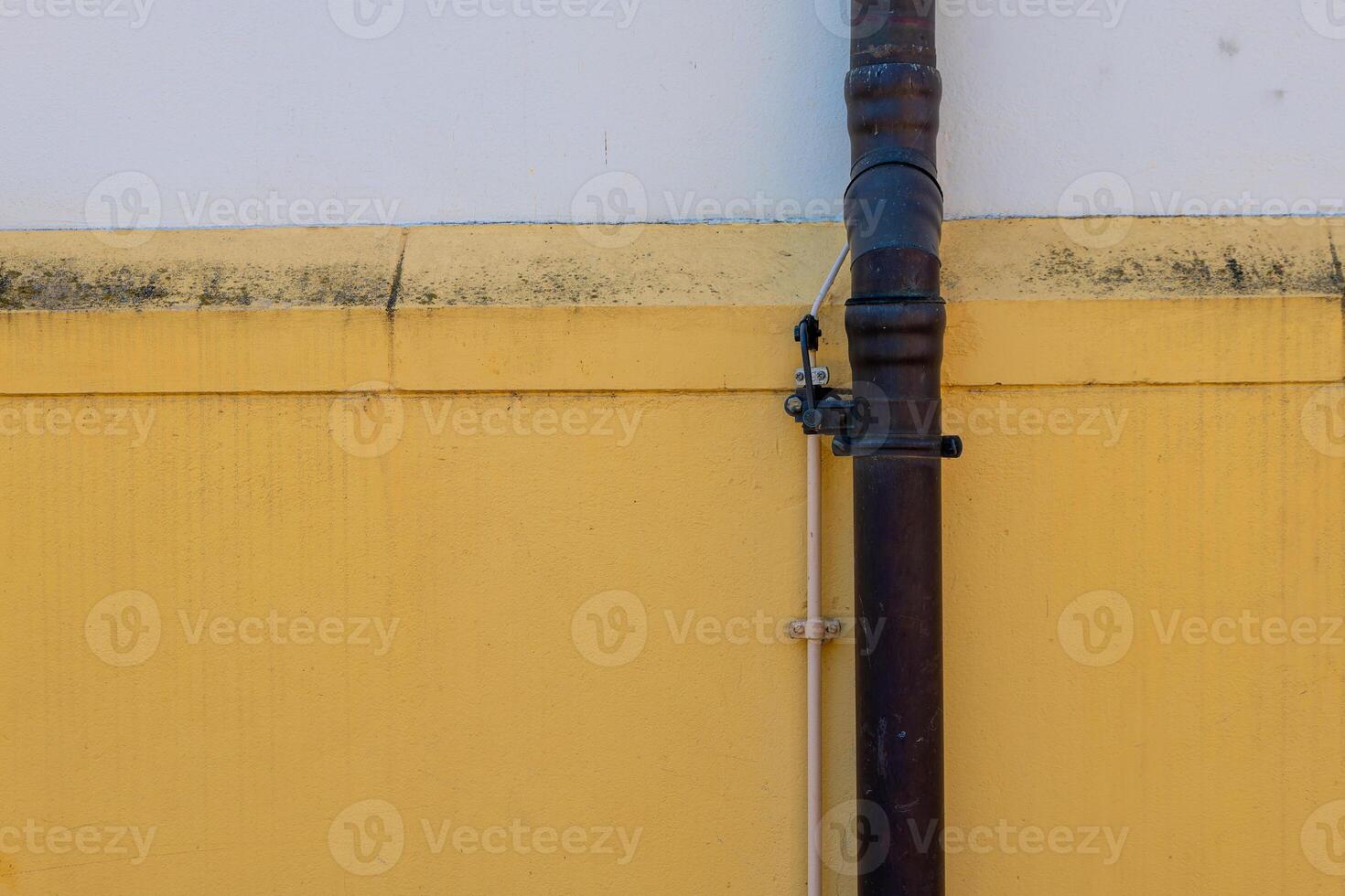 pipe is attached to a wall photo