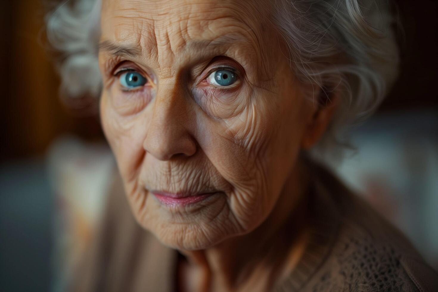 Close Up Portrait of an Elderly Woman With Blue Eyes. photo
