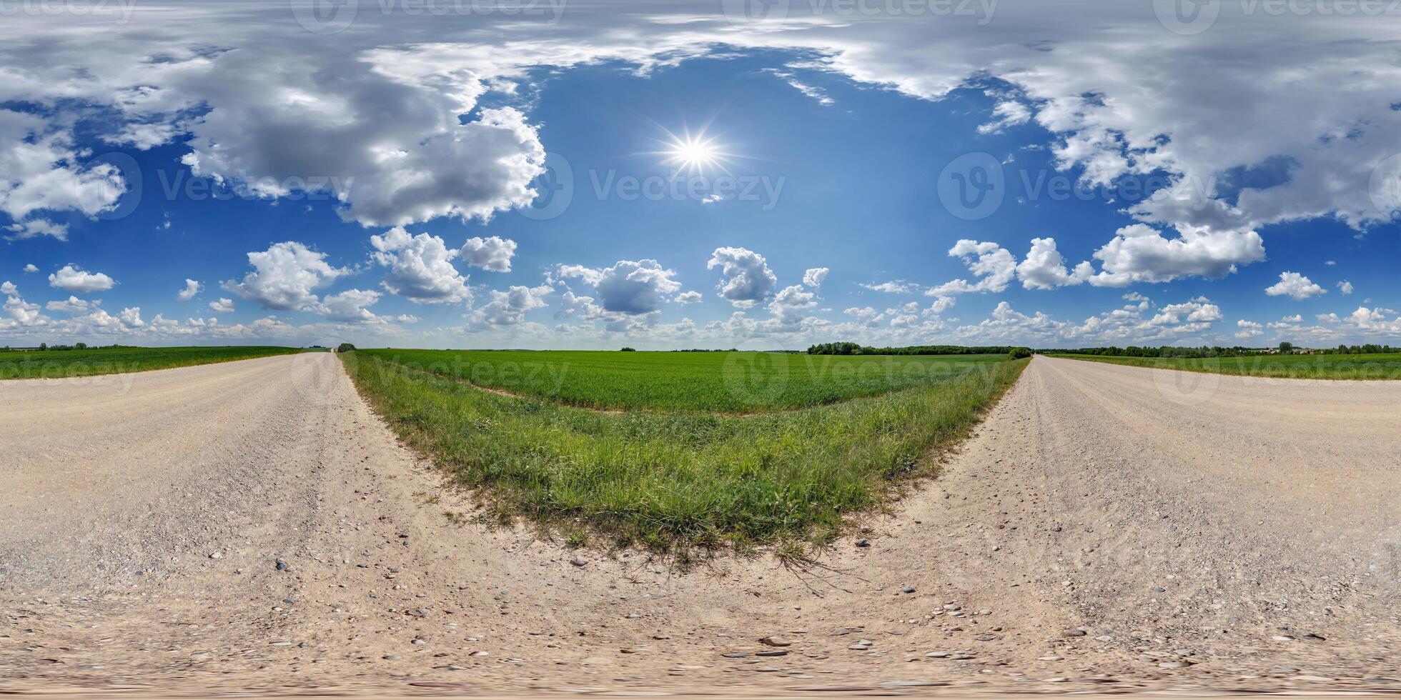 hdri 360 panorama of blue sky with awesome clouds on gravel road among fields in equirectangular full seamless spherical projection, for VR AR content or skydome replacement photo