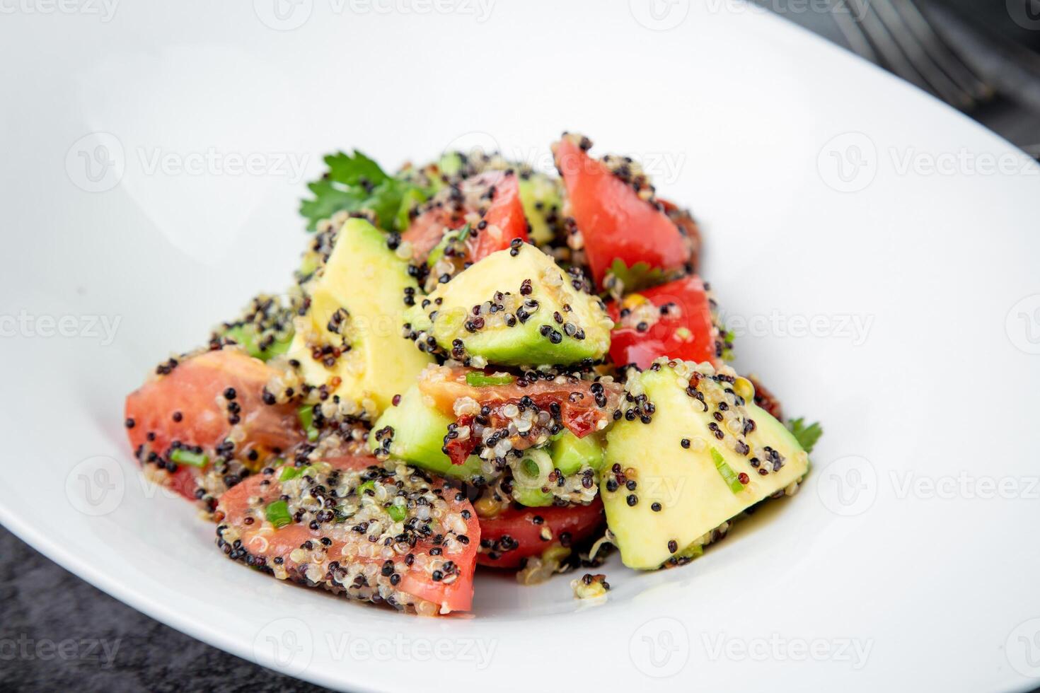 salad of tomatoes, zucchini, grated garlic with a lot of sesame seeds, top view photo