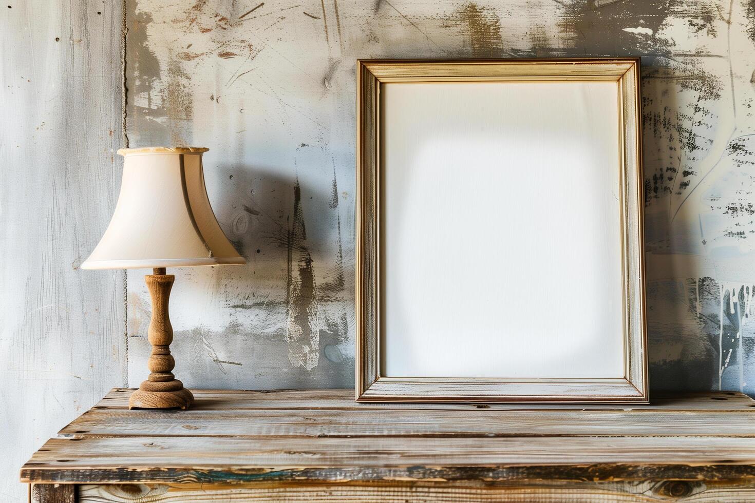 a wooden table with a blank white canvas with wood frame and a lamp photo