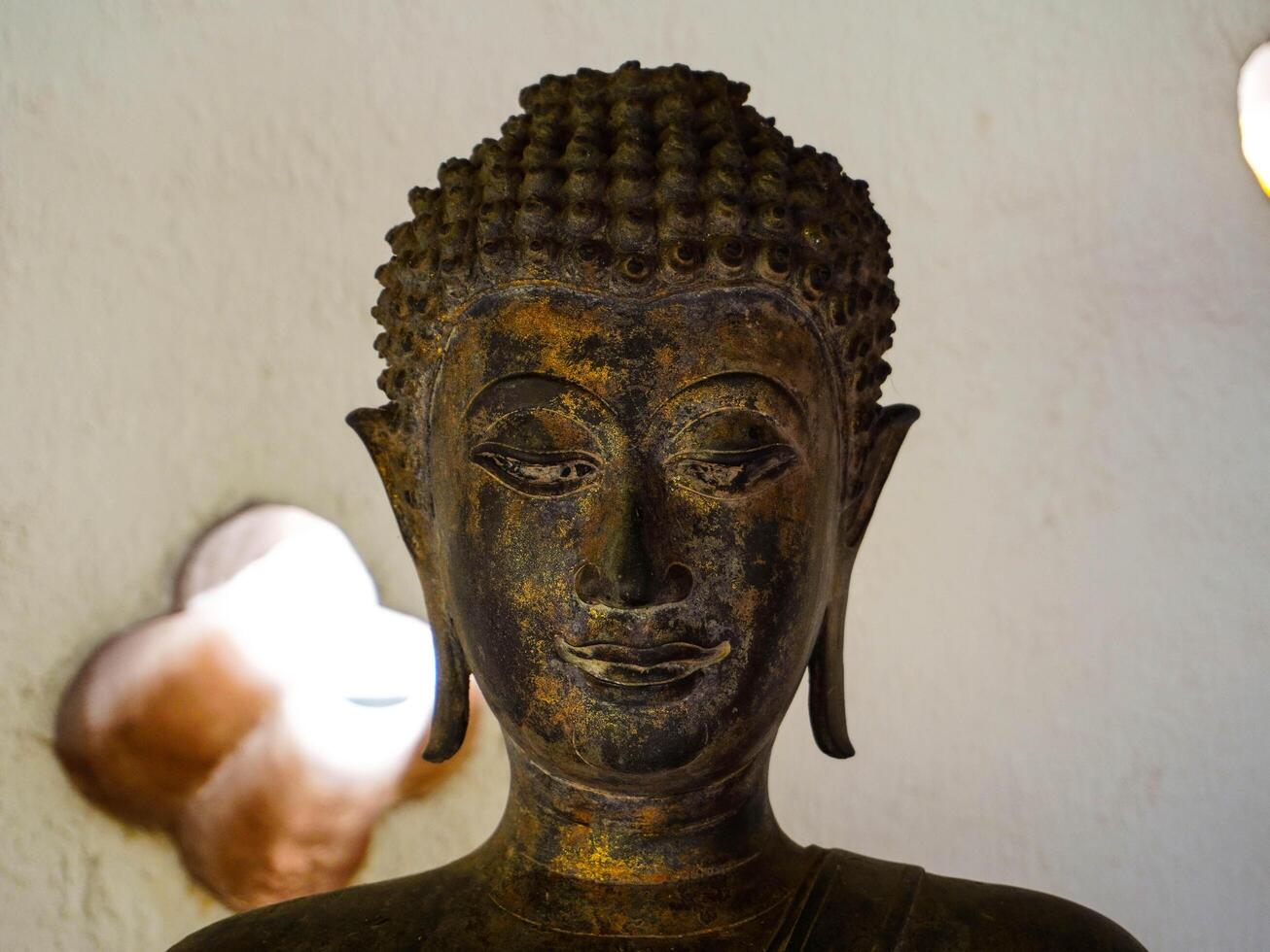 Buddha statues and sculptures at Phra That Luang or Phra Chedi Lokachulamanee is considered a very important place of worship in Vientiane, Laos. photo