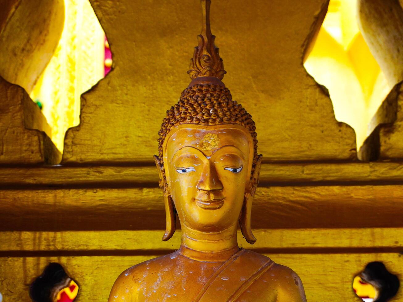 Buddha statues and sculptures at Phra That Luang or Phra Chedi Lokachulamanee is considered a very important place of worship in Vientiane, Laos. photo