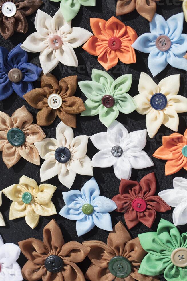 Background many buttons on the fabric in the form of a flower. photo