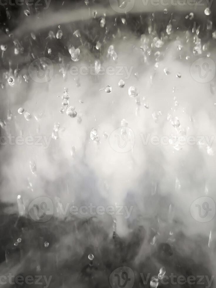 An Abstract Image of white steam with water droplets as background. photo
