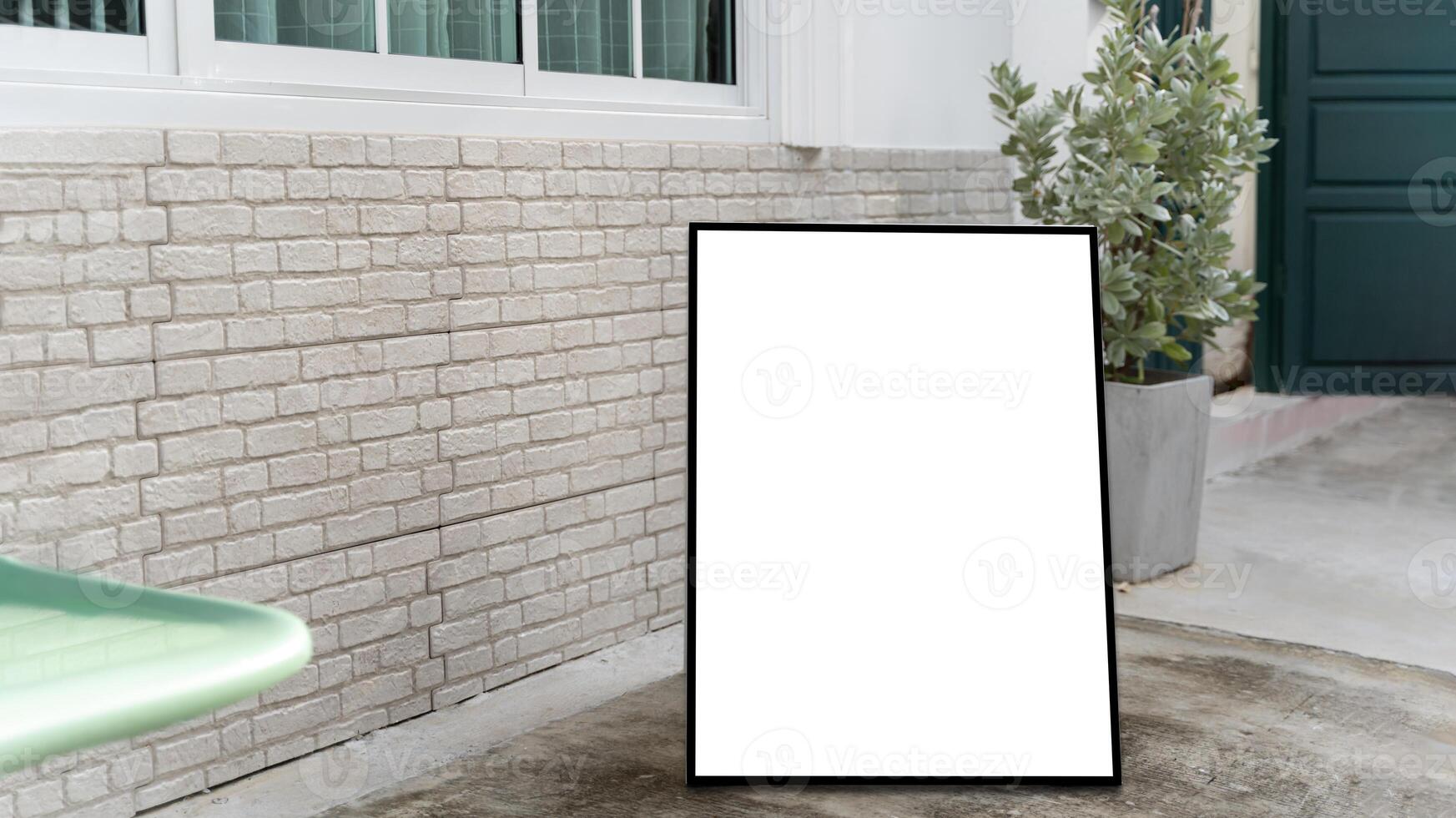 Empty white information menu stand on sidewalk near street cafe side view. White poster mockup displayed outside the building restaurant. photo