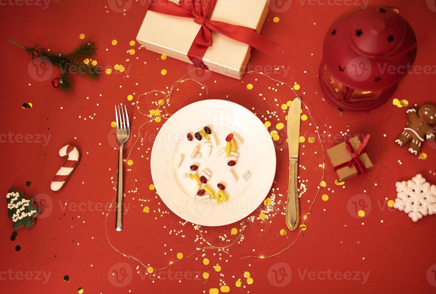 Plate with tablets, pills and capsules on bright holiday background. It served with fork and knife. photo