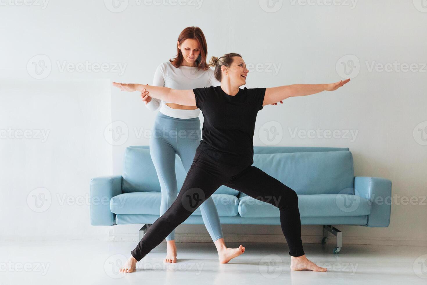Women practicing yoga at home photo