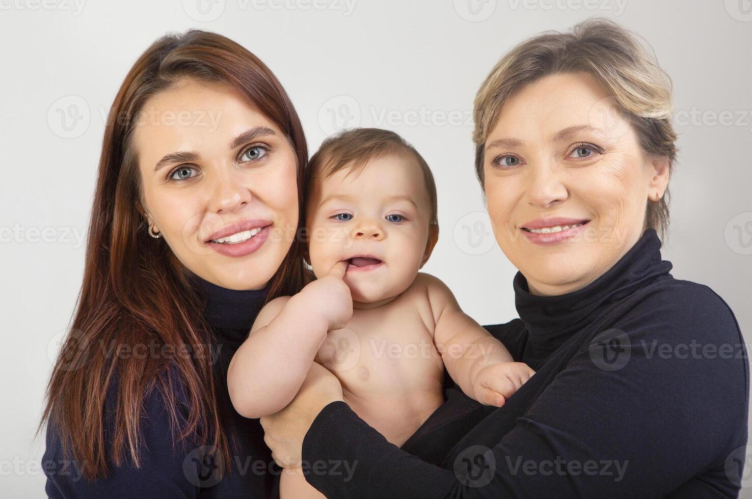 Grandmother, daughter and granddaughter on white portrait photo