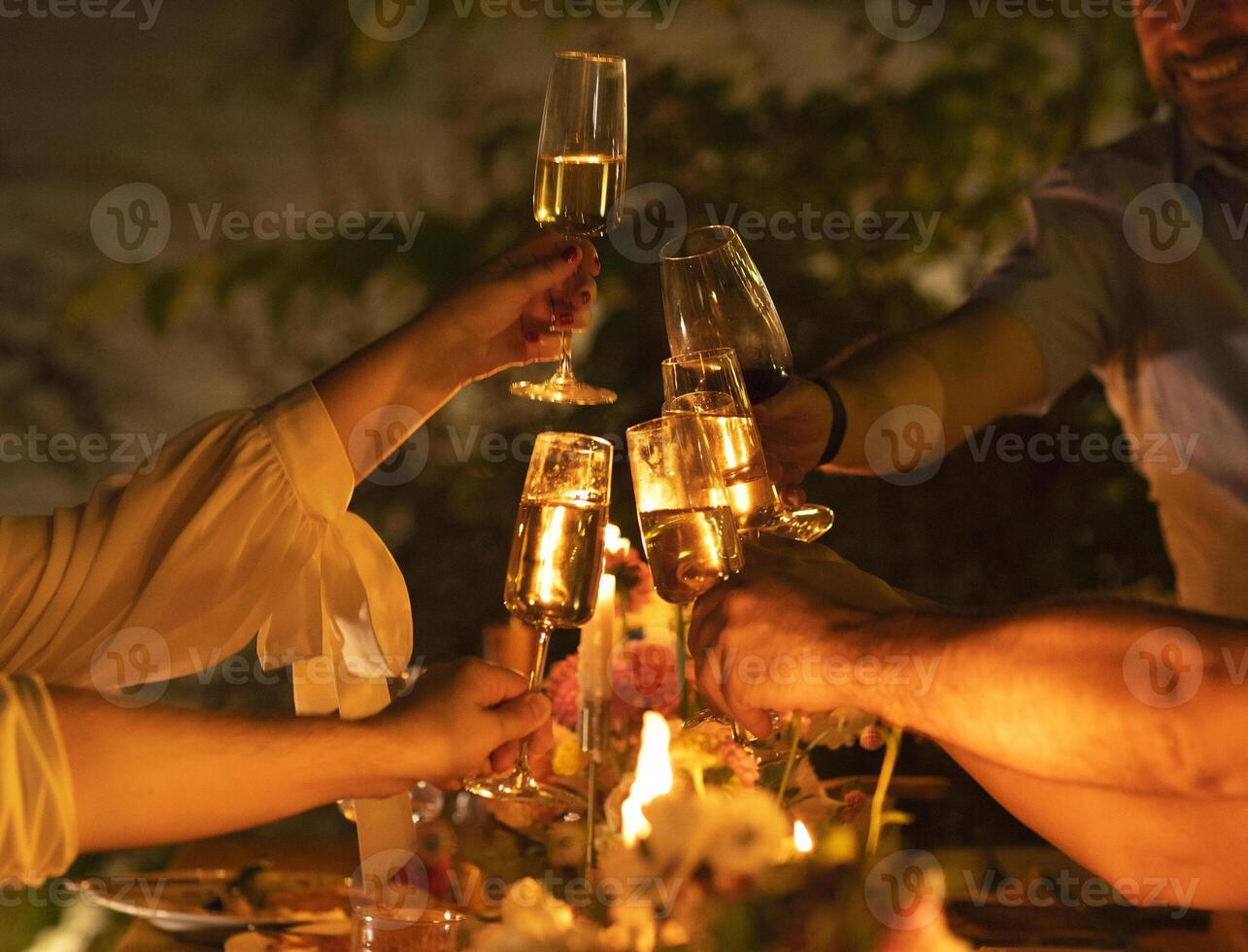 a group of people toasting with champagne glasses photo