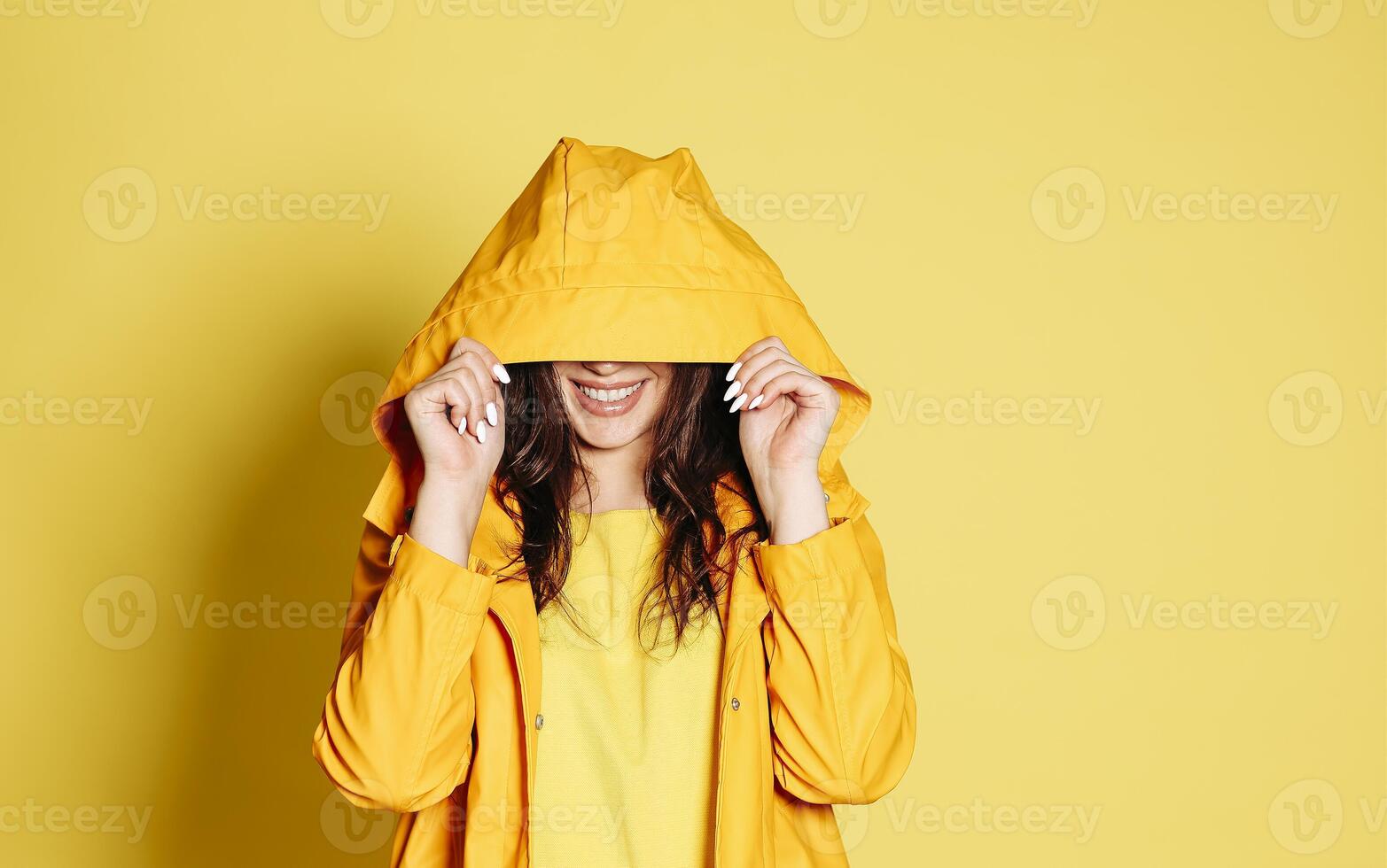 Cheerful woman in yellow outfit photo