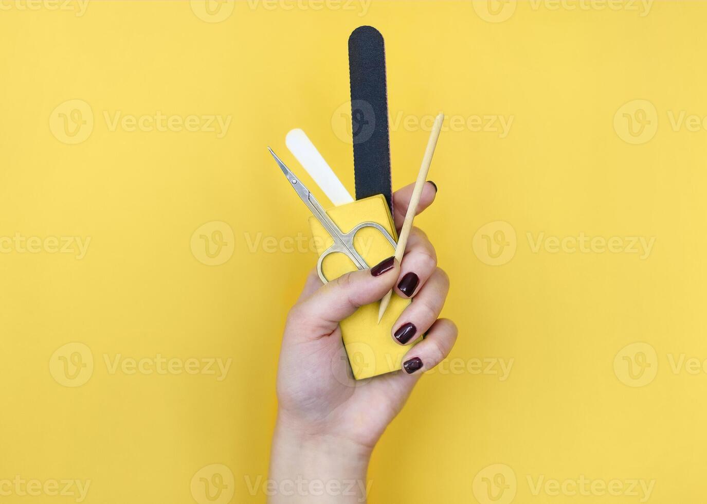 Crop woman with manicure supplies photo