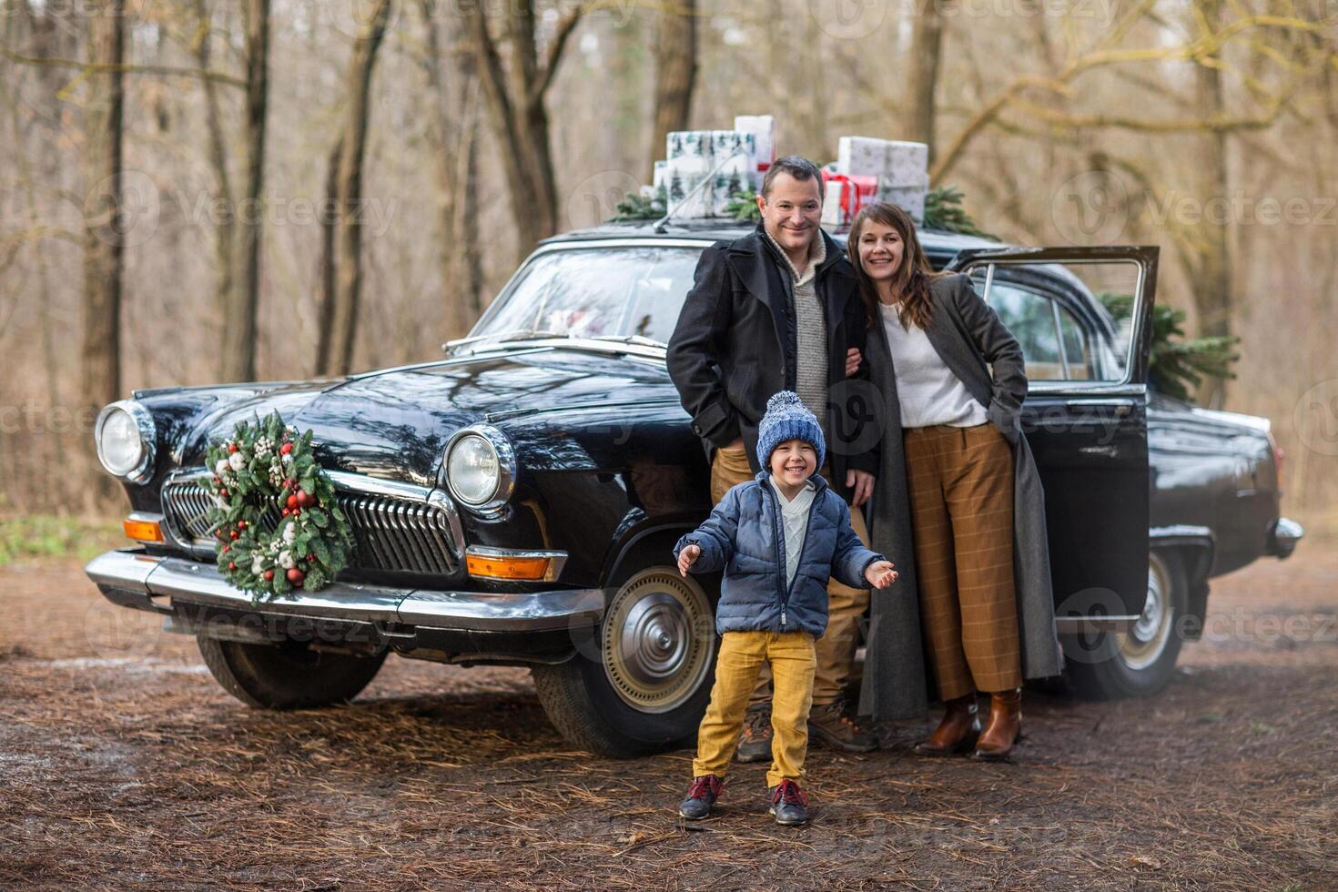 Stylish couple with son in park. Holiday concept photo