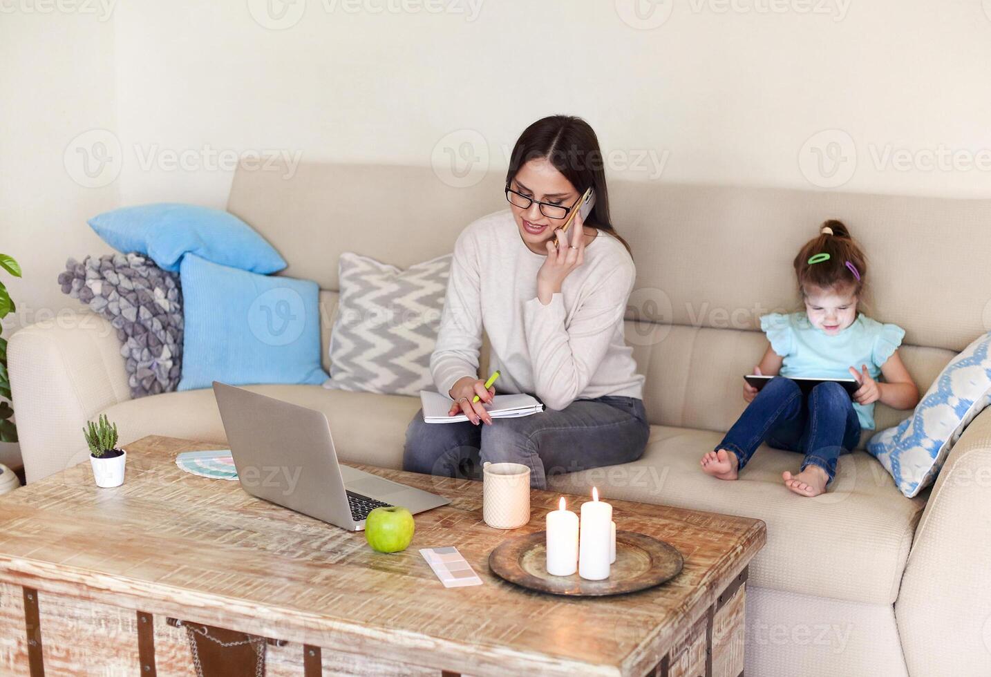Young mother working from home photo