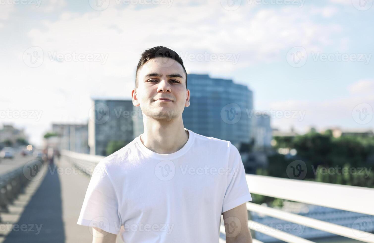 Smiling man on bridge in city photo