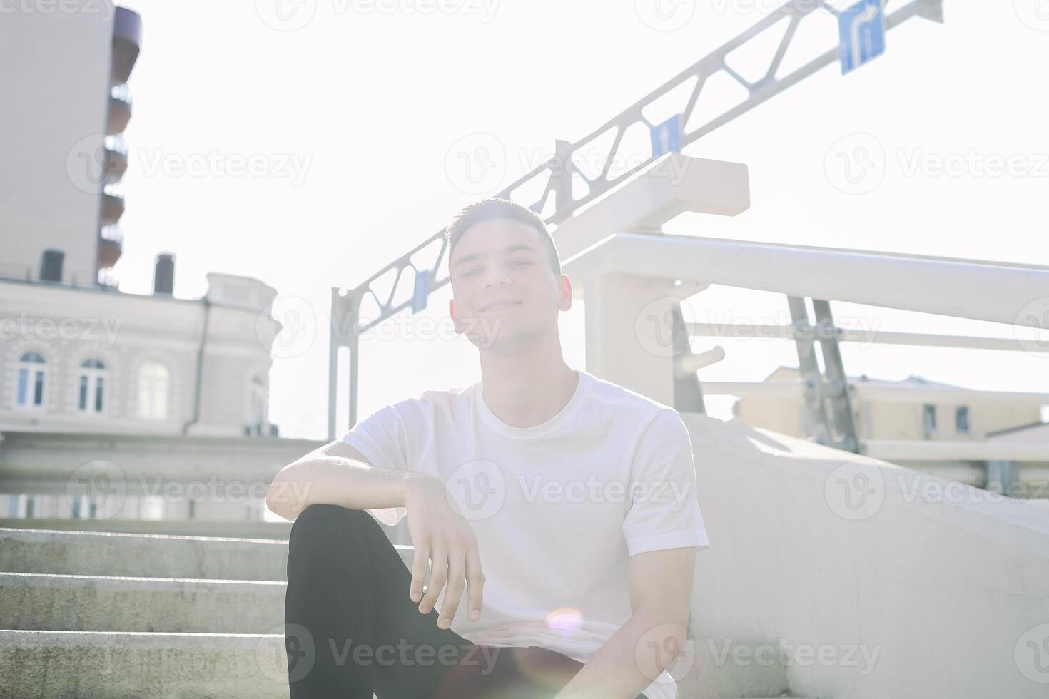 Smiling man on bridge in city photo