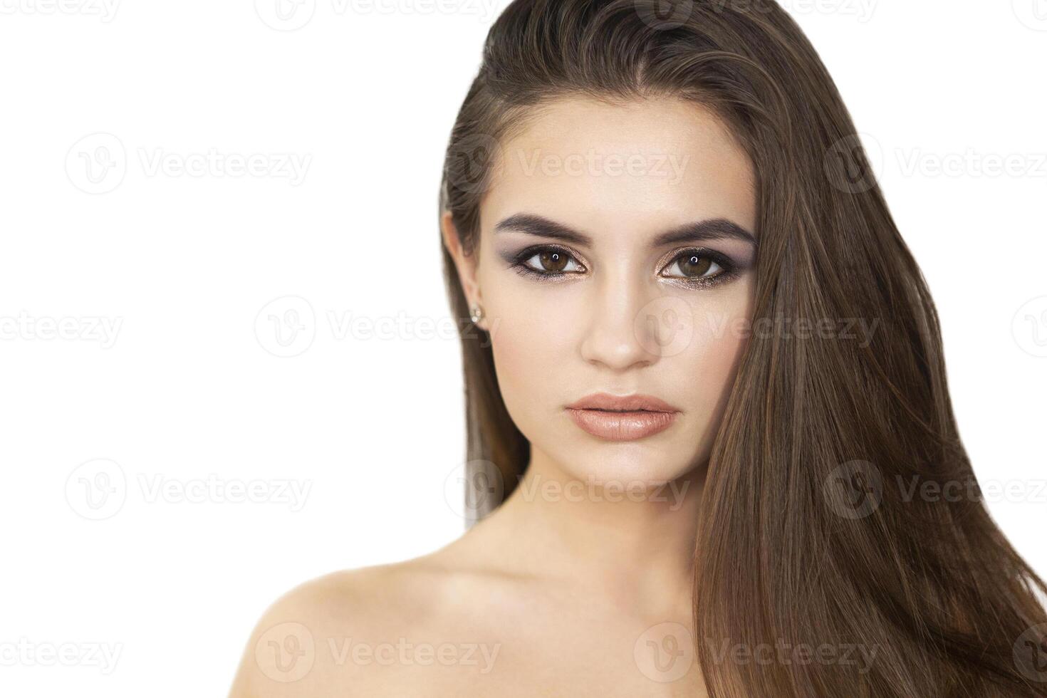 Beautiful young woman with perfect clear skin and long hair photo