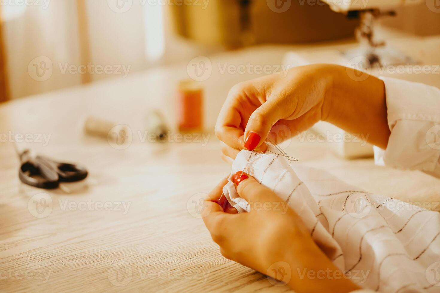 Female dressmaker creating clothes in workshop photo