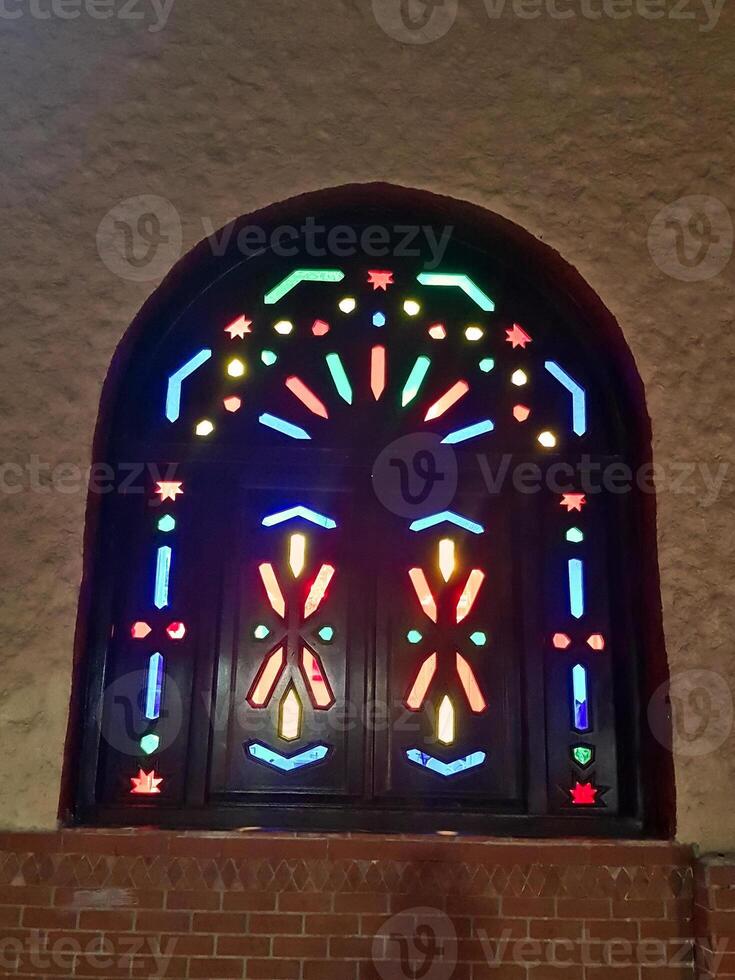 The art of the bright wooden window with colored lights photo
