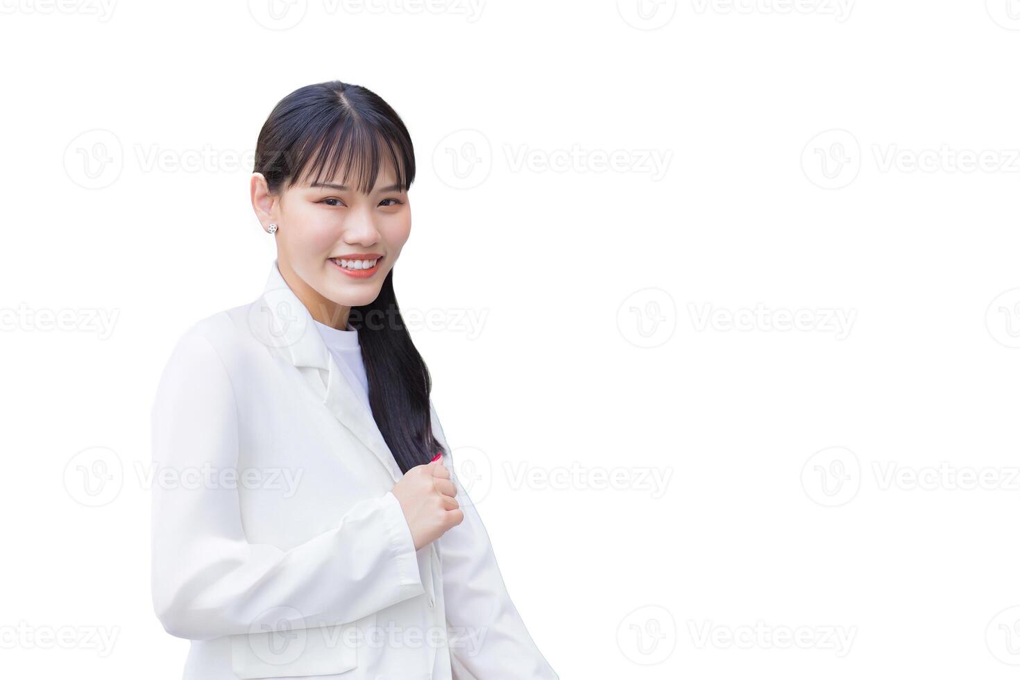Confident young business Asian working woman who wears white shirt and shoulder bag smiles happily while she is standing to office for work while isolated white background. photo