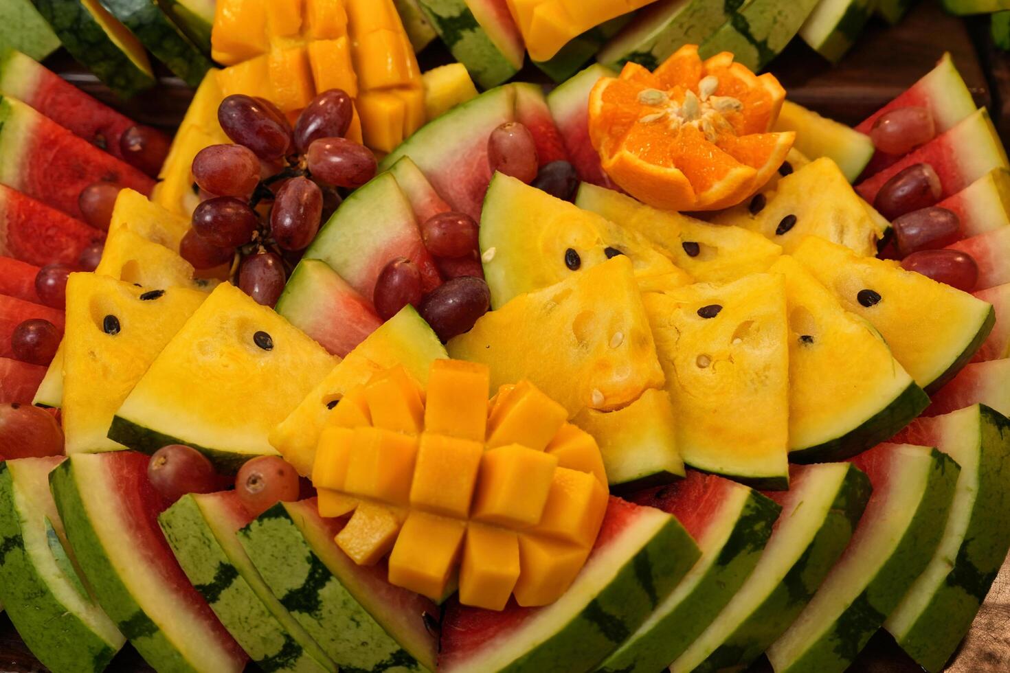 a large plate of fruit arranged in a circle photo