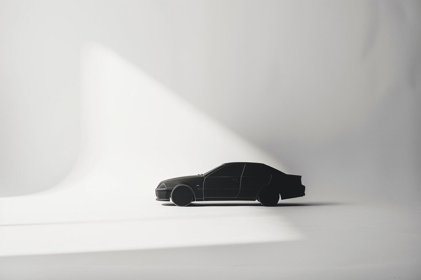 Abstract representation of cars silhouette against stark white  playing with shadows and negative space photo