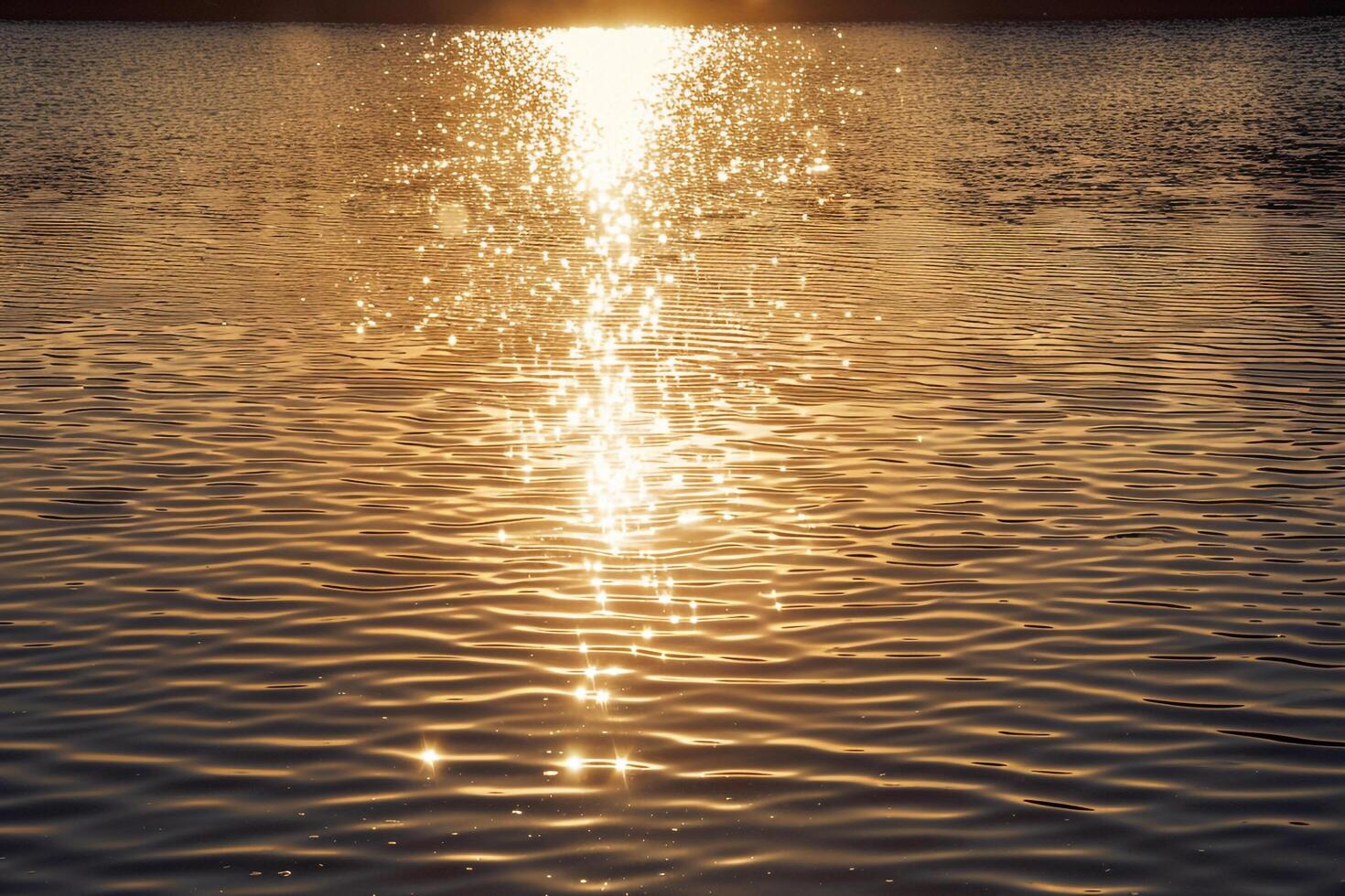 Seascape Sunlight Casting Golden Glow on the Surface of Lake nature background photo