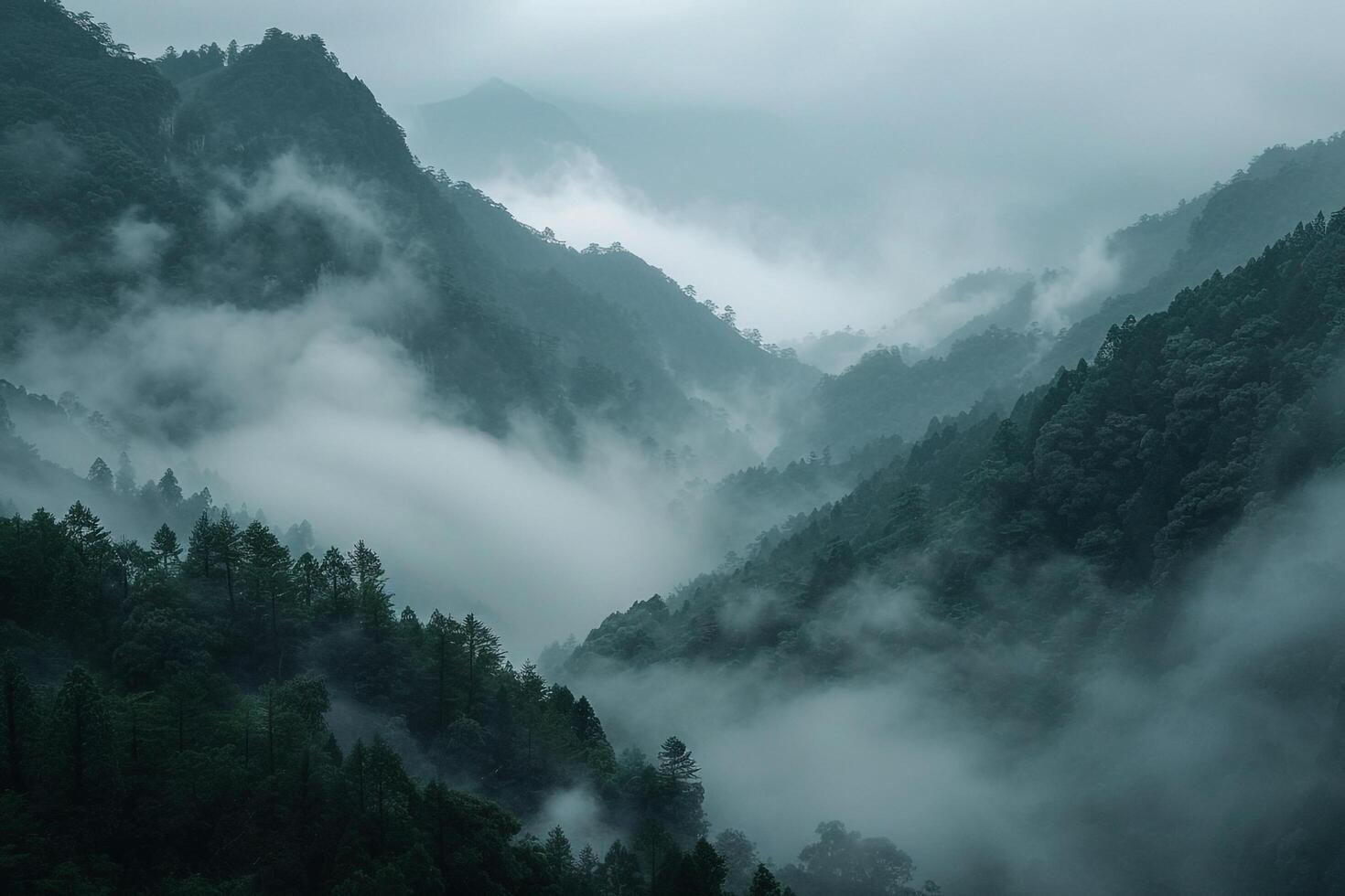 Landscape Ethereal fog covered valley with distant mountains peeking through the mist   nature background photo