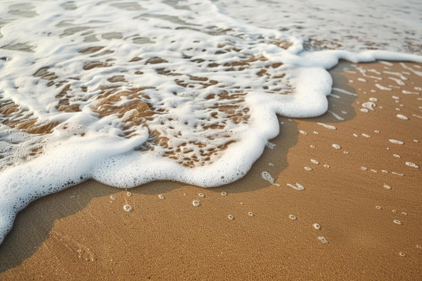 Sandy Beach nature background with Waves and Foam Patterns photo