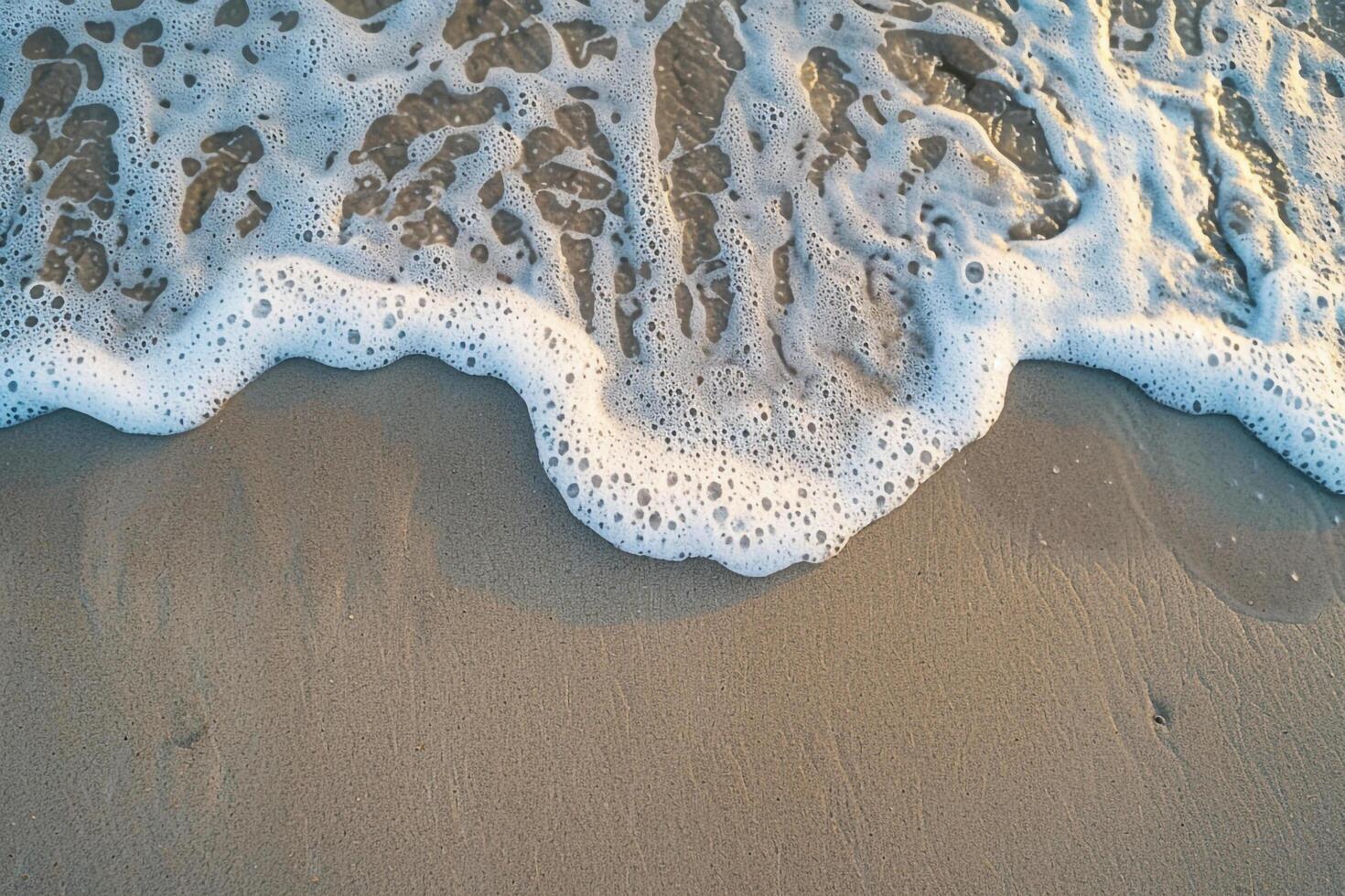 Sandy Beach nature background with Waves and Foam Patterns photo