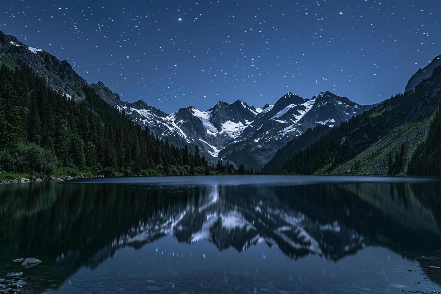 Serene Alpine Lake with Snow Capped Peaks and Pine Forests Under a Clear Starry Sky   nature background photo
