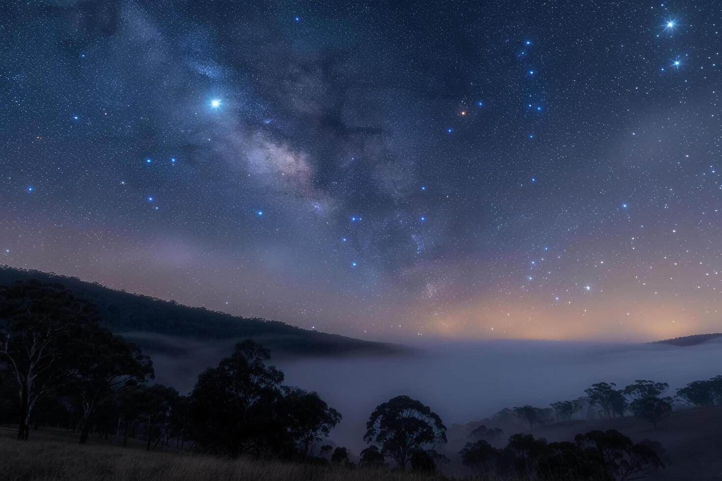 Orion Constellation Above Foggy Valley in a Starry Night Background Nature photo
