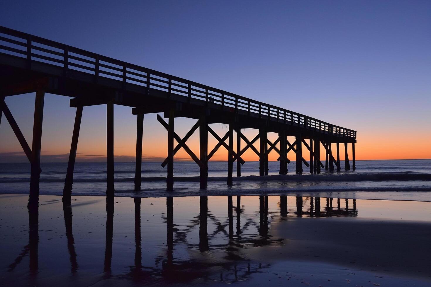Pier Silhouetted Against Twilight Sky Nature Background photo