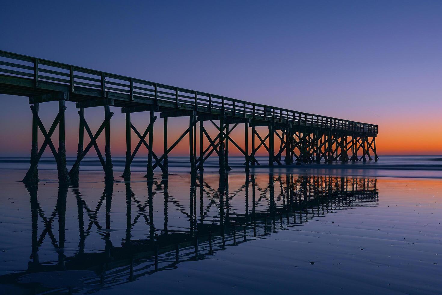 Pier Silhouetted Against Twilight Sky Nature Background photo