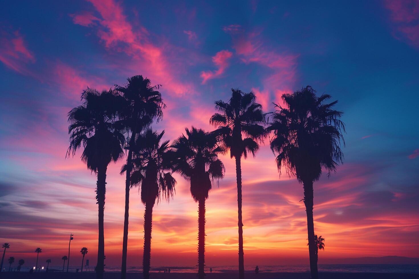 Palm Trees Silhouetted Against a Dramatic Sky During Twilight on a Tranquil Beach in Nature Background photo