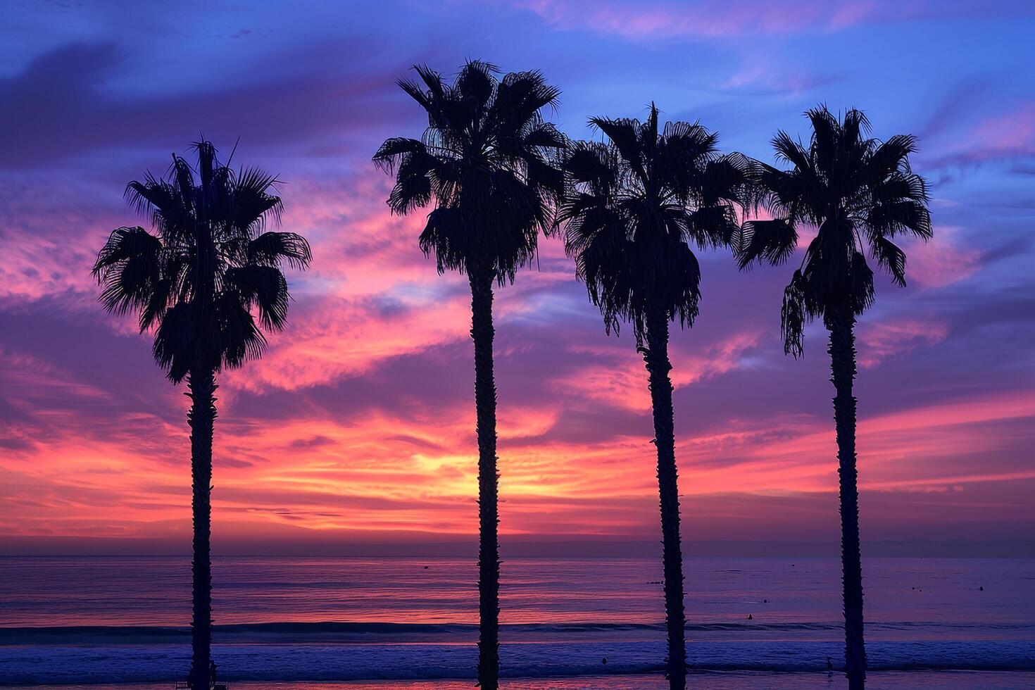 Palm Trees Silhouetted Against a Dramatic Sky During Twilight on a Tranquil Beach in Nature Background photo