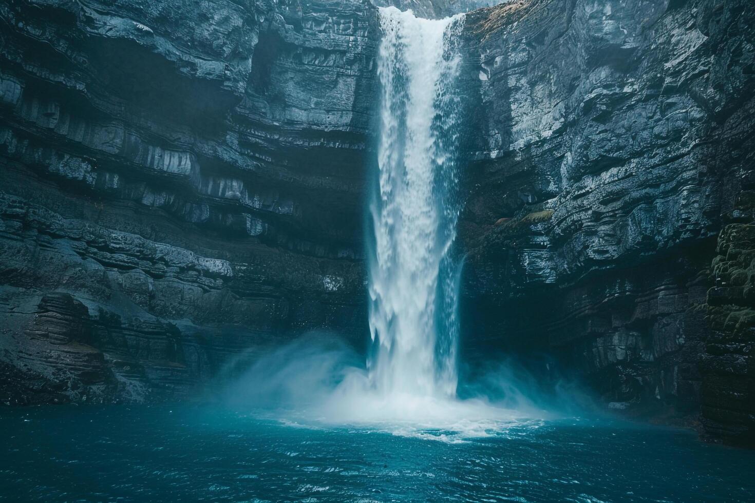 A Grand Waterfall Cascading Down a Volcanic Rock Face into a Turquoise Pool Nature Background photo