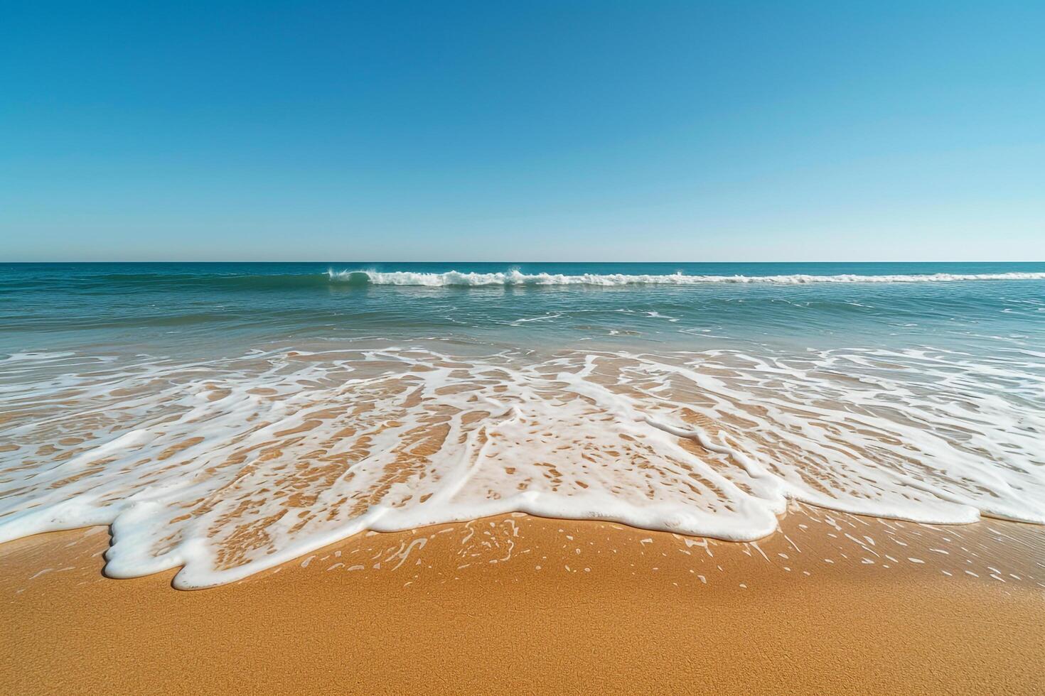 Empty Stretch of Golden Sand with Gentle Waves Lapping at the Shore Under a Clear Blue Sky Background Nature photo