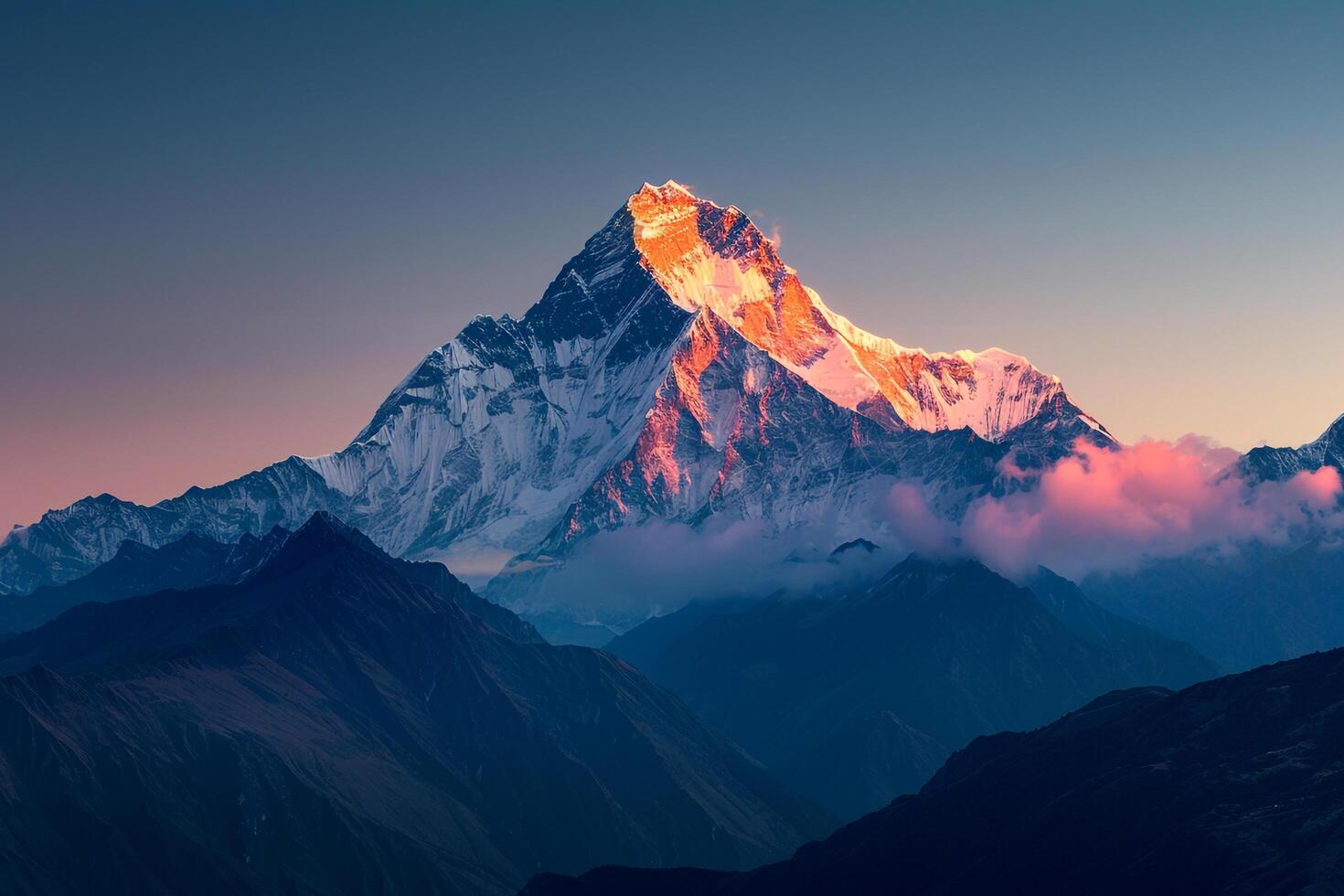 Snow Capped Mountain Peak Glowing in the First Light of Dawn Background photo