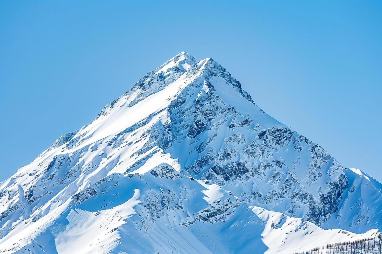 Snowy Mountain Peak Against a Clear Blue Sky. Nature. Background photo
