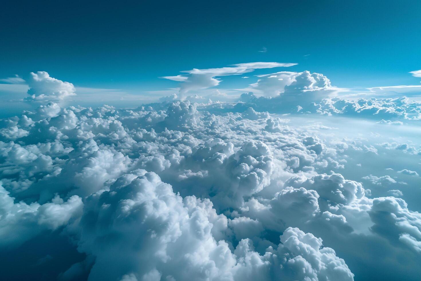 Puffy White Clouds Against a Deep Blue Sky Nature Background photo