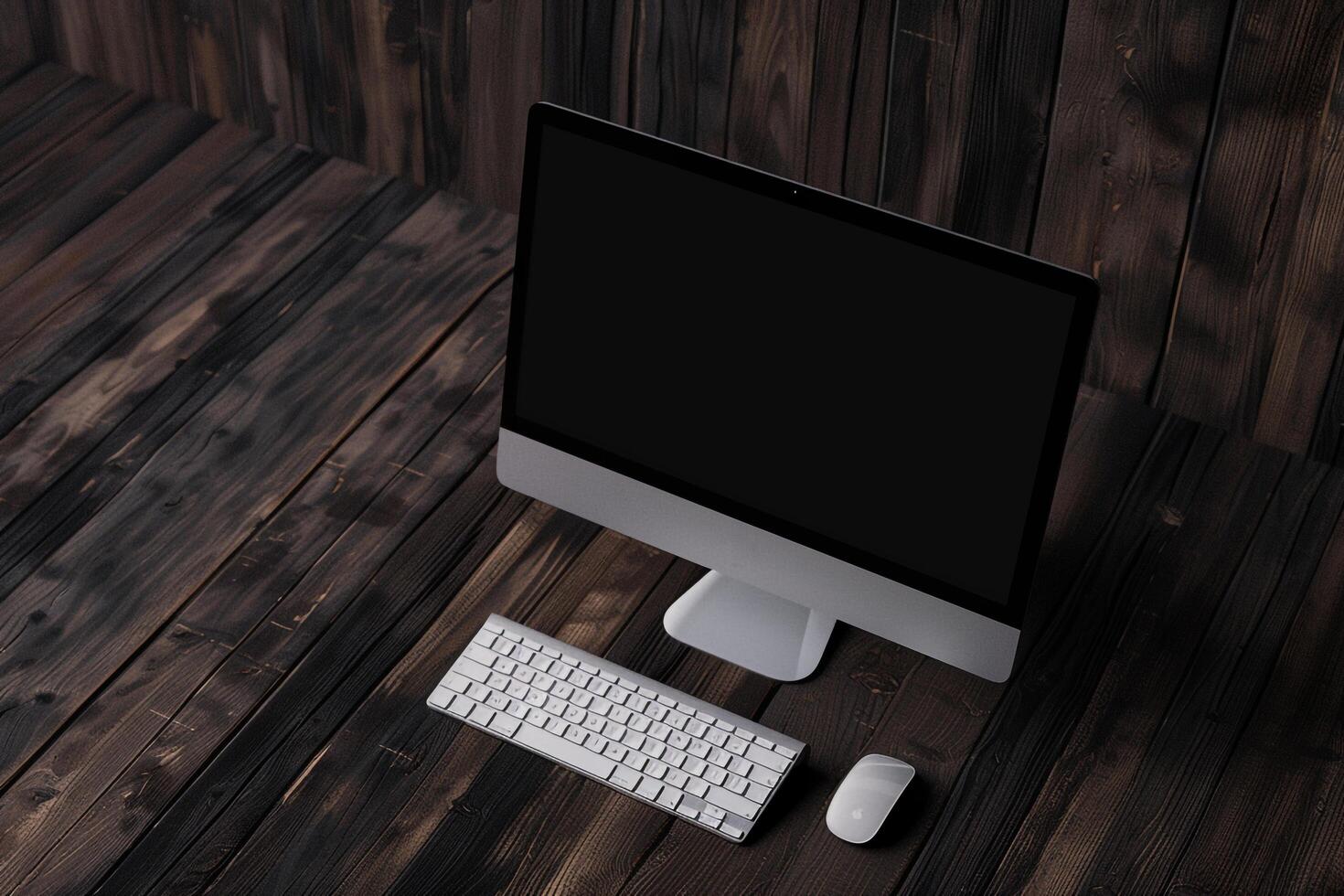 Computer monitor mockup with blank screen on a  walnut wood background photo
