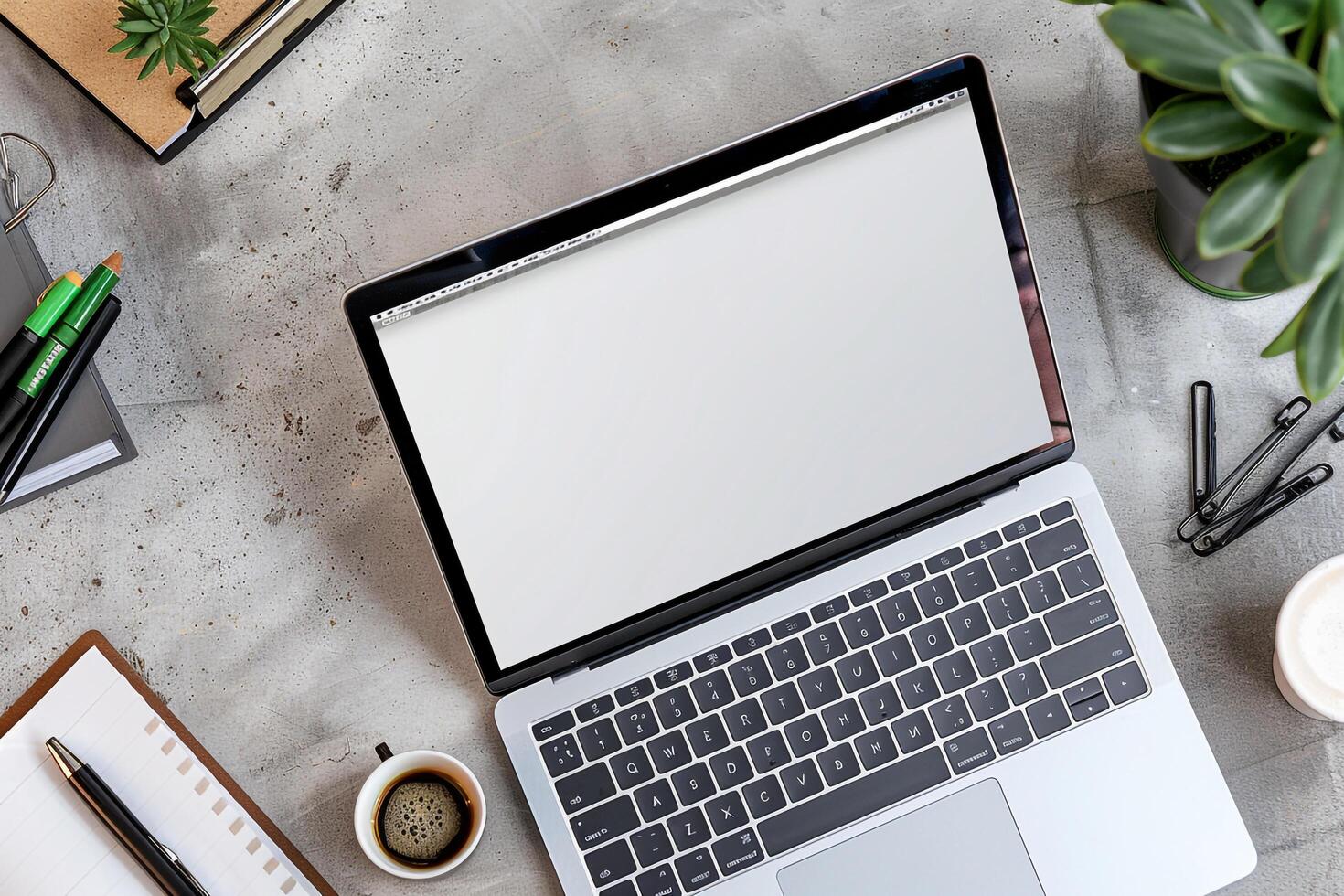 Desk Setup with Laptop Mockup Showing  Screen Surrounded by Office Supplies Background photo