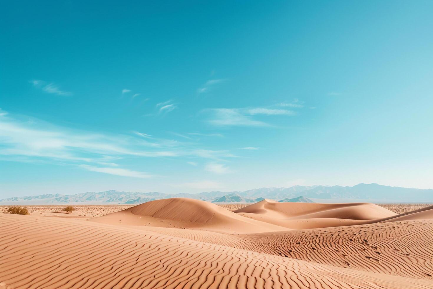 Desert Dunes Under a Blue Sky with Distant Mountains for Desert Exploration graphy Background photo